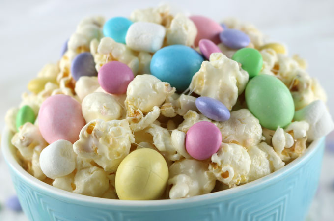 Celebrate with our Easter Candy Popcorn - a fun Easter Dessert that is both sweet and salty and chock full of Easter Candy. This yummy Easter Treat is super delicious and so easy to make. Follow us for more fun Easter Food Ideas.