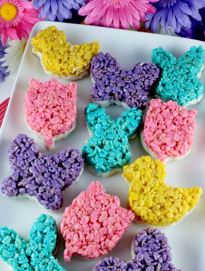 Springtime Rice Krispie Treats - an Easter dessert that is fun, easy and delicious. Your family will love this unique Easter treat that is dipped in yummy White Chocolate. Follow us for more great Easter Food Ideas.