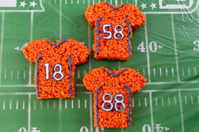 These Denver Broncos Rice Krispie Treats Team Jerseys are a fun football dessert for a game day football party, an NFL playoff party, a Super Bowl party or as a special snack for the Denver Broncos fans in your life. Go Broncos! And follow us for more fun Super Bowl Food Ideas.