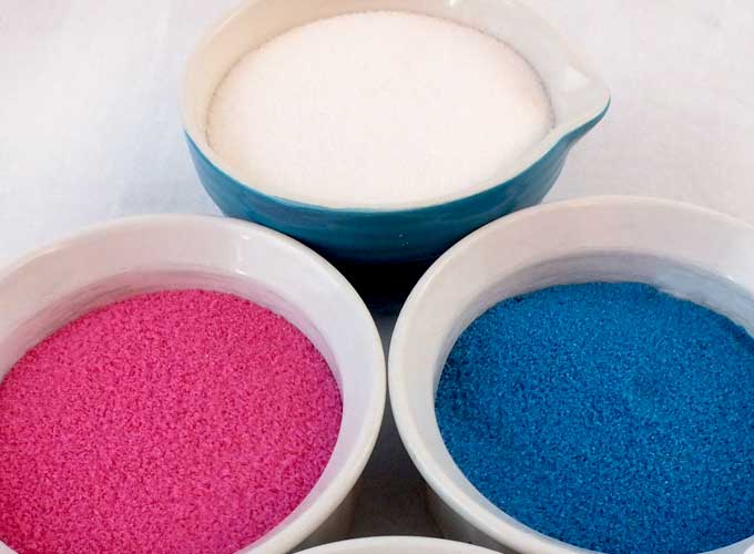 How to Make Your Own Sparkling Sugar - we have step by step directions on how to make your own homemade colored sugar sprinkles. Now you can have edible glitter sugar in any color your want! Throw out that store bought sanding sugar and make your own, it couldn't be easier! Follow us for more great baking and decorating tips. #SandingSugar #SparklingSugar #GlitterSugar