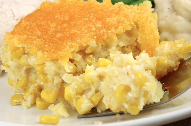 Our Corn Casserole recipe is a family favorite Easter food side dish - this sweet-savory, corn bread "like" dish is super delicious and very easy to make. It will be one of your family's favorite Holiday Foods. Pin this yummy side dish for later and follow us for more Easter Dinner Food Ideas. #EasterDinner #CornCasserole #SideDish #Corn