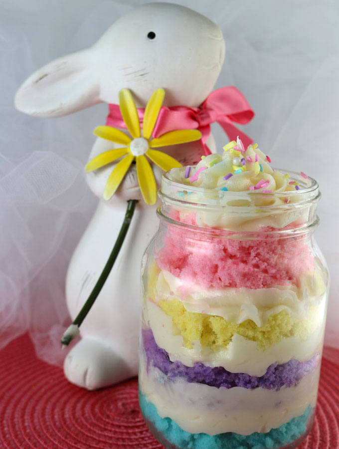 Our Springtime Cupcake in a Jar featuring colorful cake layers and delicious Buttercream Frosting is a unique take on cupcakes and a great Easter dessert. It would also be great for a Mother’s Day Brunch, a baby shower or a kid’s party. Follow us for more delicious Easter Treats ideas.