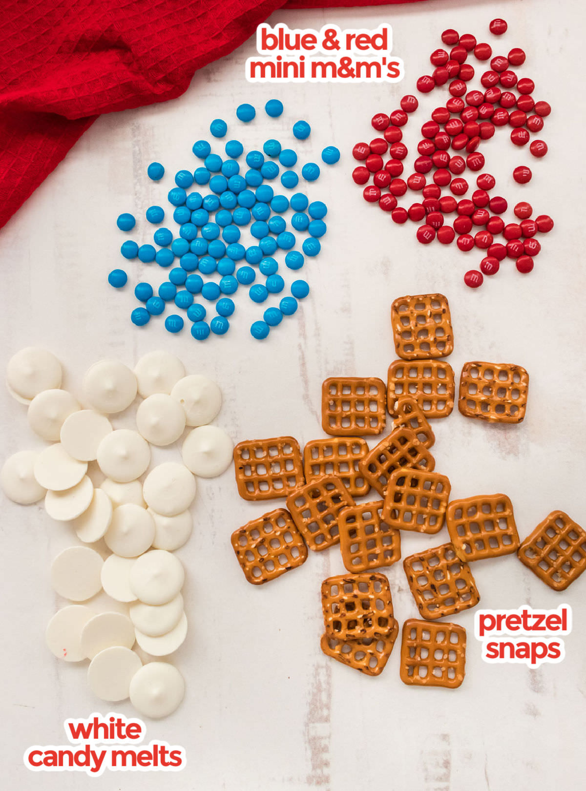 All the ingredients you will need to make Patriotic Pretzel Bites including White Candy Melts, Pretzel Snaps and Red and Blue Mini M&M's.