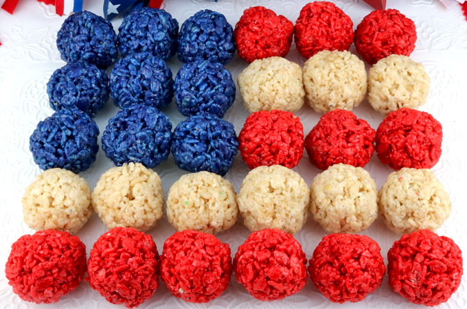 Patriotic Pretzels - yummy bites of sweet and salty Red White and Blue Fourth of July goodness that are super easy to make. They are perfect as a extra treat at a 4th of July party. Pin this colorful 4th of July dessert for later and follow us for more fun 4th of July Food Ideas. #4thofJuly #fourthofjuly #4thofJulyTreats #4thofJulyDesserts #4thofJulyFoodIdeas